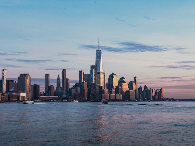 New York City skyline across the Hudson River from Hoboken at golden hour