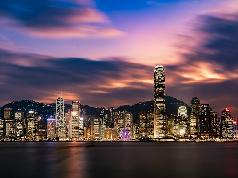 Hong Kong Island skyline across Victoria Harbour at dusk